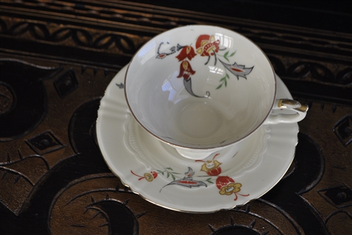 Floral design porcelain cup and saucer