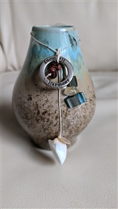 Small ceramic vase with harmony pendants