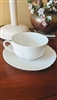 Haviland France white embossed teacup and saucer