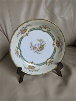 Vintage 1967 Noritake Lamara porcelain coupe soup bowl with blue floral design and gold trim on a white ground