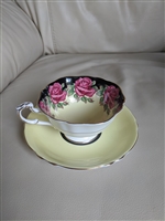 Rose medallions on yellow Paragon teacup saucer