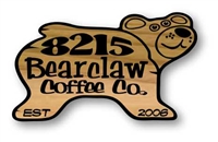 These custom wooden signs feature a smiling black bear