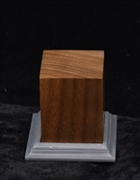 Wood base kit comprised of a polished walnut body and a 3D printed resin decorative foot/pedestal. It includes a wood screw and magnetic strip.  The body measures at 1.5 x 1.5 x 1.75 inches and the foot/pedestal measures at 2 x 2 x 3/8 inches.
