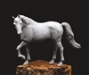 Digitally sculpted and 3D printed horse. It is in a walking position and looking left. The kit is comprised of a body and a tail.