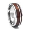 STEEL REVOLTâ„¢ Top Of The Barrel is a Tennessee Whiskey Ring. It is a 8mm comfort fit domed tungsten carbide wedding ring with wood cut from the whiskey barrels once used by the Jack Daniel's Distillery