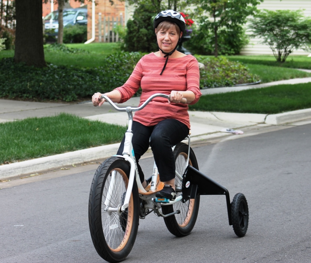 Adult heavy-duty bicycle training wheels and wheel stabilizers.