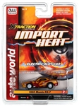 AUTO WORLD GOLD... XTRACTION IMPORT HEAT 1995 MAZDA RX-7 (GOLD/RED)