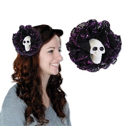 The Skull Hair Clip will add a little flair to your Halloween or Day of the Dead outfit. A white plastic skull is surrounded by layers of black lace tipped with purple glitter. Simply clip into your existing hair. No returns accepted.