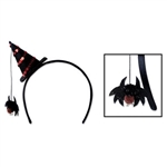 The Spider Witch Hat Headband is a standard black fabric covered headband with a black felt witch hat off to the side. The witch hat has red sequins in a spiral. Attached to the tip is a string with a spider which hangs down. One per package. No returns.
