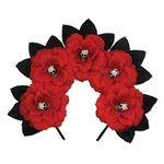 The Day of the Dead Floral Headband is a black headband adorned with red fabric flowers and black leaves. Each flower features a small plastic creepy face bead in the center. One size fits most adults. No returns. One per package.