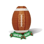 The Game Day Football Lantern Centerpiece is made of paper and measures approx 11 in tall and 7 in wide. Each package contains 1 football shaped lantern, 4 cardstock "Game Day" signs that make the stand, and 1 metal support. Simple assembly required.