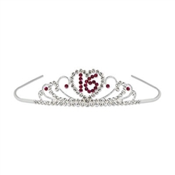 The Sweet 16 Royal Rhinestone Tiara features a silver metal tiara adorned with realistic looking gemstones in an intricate design. A rhinestone heart featuring the number 16 is centered on the front. One per package.