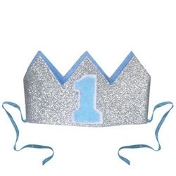 The Glittered Baby's 1st Birthday Crown is a silver glittered crown with light blue lining and a blue "1" on the front. It has two detachable ribbon ties and measures 4 1/2 inches wide and 2 1/2 inches tall. Contains one (1) per pack. No returns.