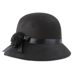This semi-rigid black felt hat was a popular ladies fashion accessory in the 1920's and 30's. A black satin ribbon and decorative felt flower adorn the side of this hat. Sized to fit most adults, this item is ineligible for returns due to hygiene concerns