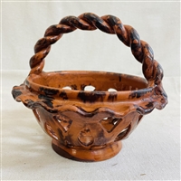 Pierced Redware Basket with Sponging and Braided Handle $175