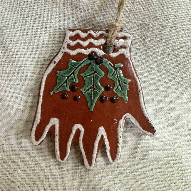 Hand with Holly Ornament $30