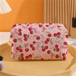 Pink makeup bag with cherry bow print