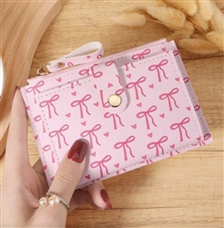 Pink wallet with hot pink bows and hearts