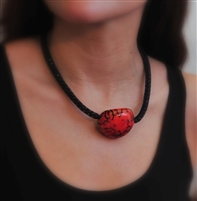 Choker necklace with a dyed nut at center and mesh filled with Czech crystals